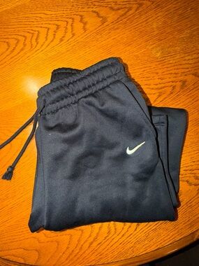 Nike Women’s Black Sweatpants with White Swoosh flare bottoms